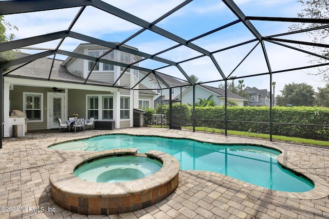 view of swimming pool with a patio, a lanai, and a pool with connected hot tub