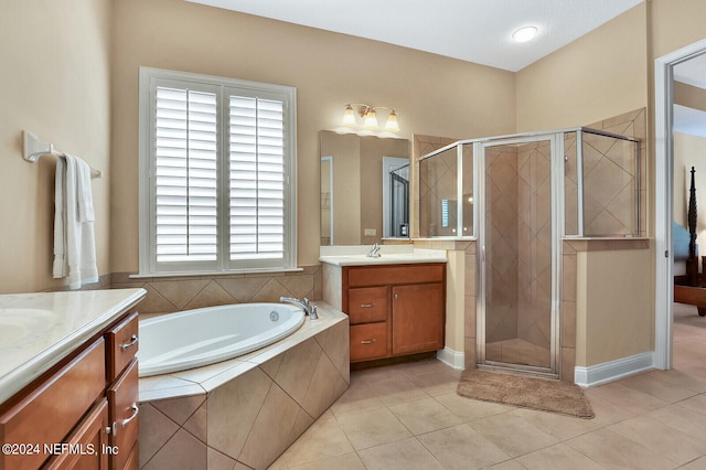 bathroom with two vanities, a sink, a shower stall, and a bath