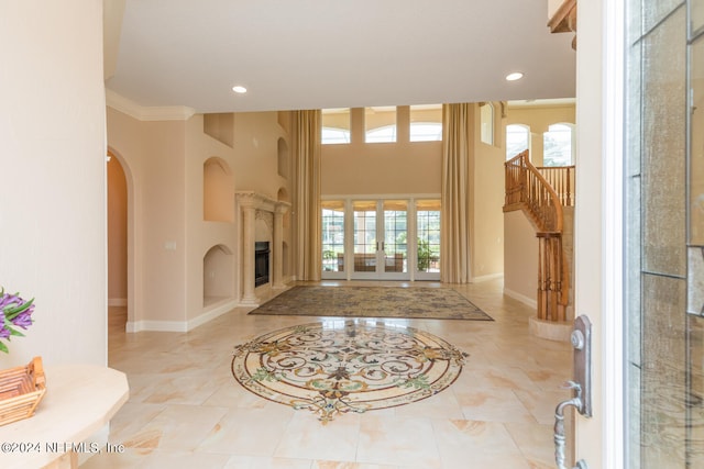 living area with recessed lighting, french doors, plenty of natural light, and baseboards