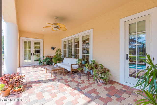 view of patio / terrace with french doors and a ceiling fan