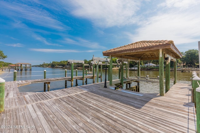 view of dock featuring a water view and boat lift