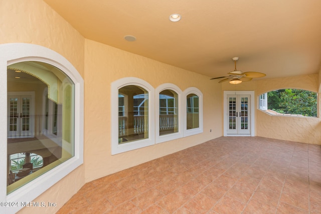 view of patio featuring french doors and a ceiling fan