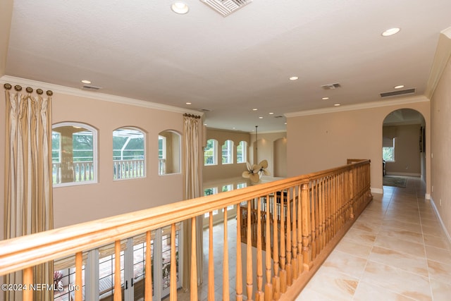 hall featuring visible vents and ornamental molding