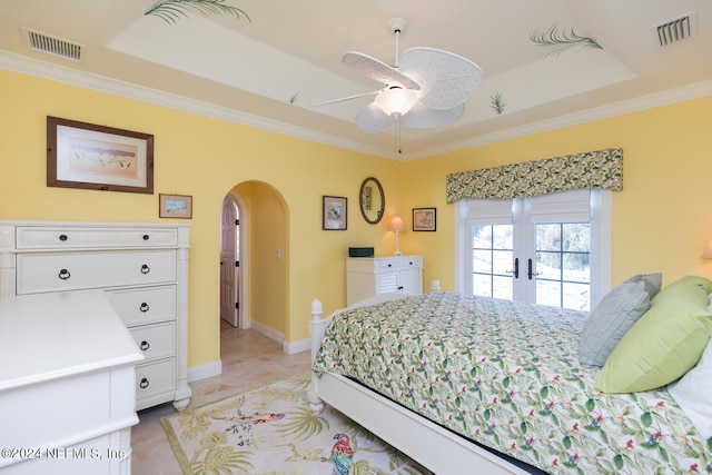 bedroom featuring visible vents, arched walkways, and crown molding