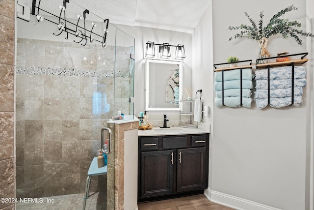 bathroom with vanity and a shower with shower door