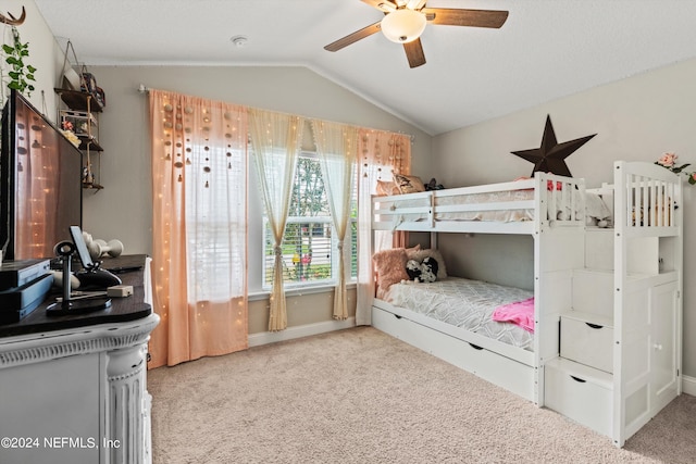 carpeted bedroom featuring vaulted ceiling and ceiling fan