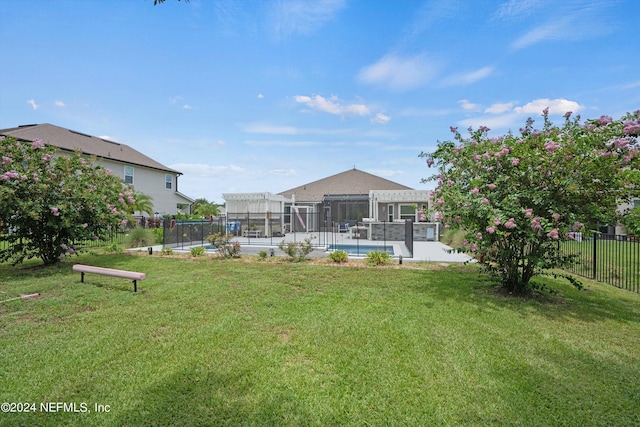 view of yard featuring a pergola and a fenced in pool