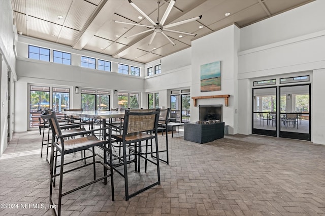 dining room featuring a towering ceiling