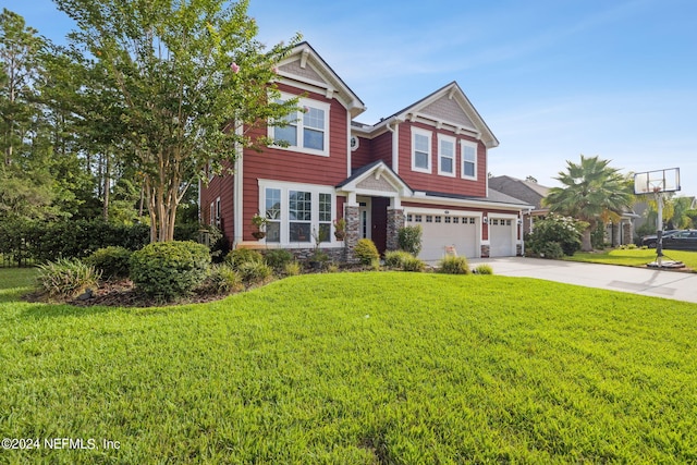 view of front of home with a garage and a front yard