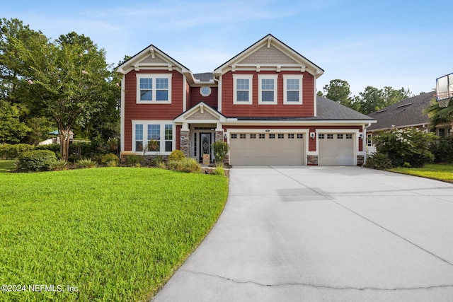 craftsman-style home with a garage and a front yard