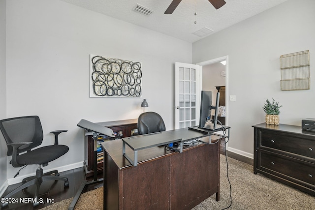 office area featuring a textured ceiling and ceiling fan