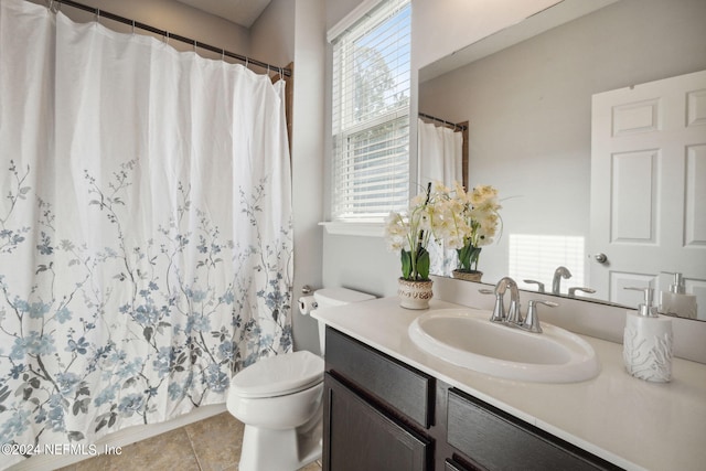 bathroom with vanity, tile patterned floors, and toilet