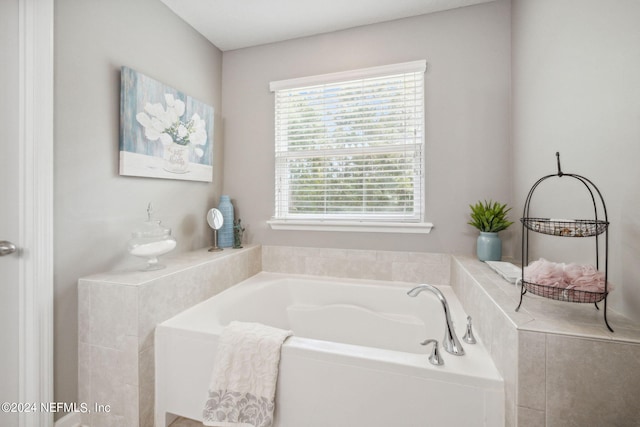 bathroom with tiled tub