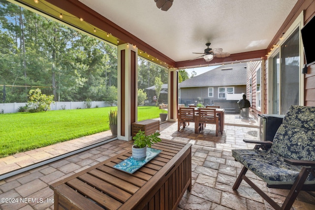 view of patio / terrace featuring ceiling fan