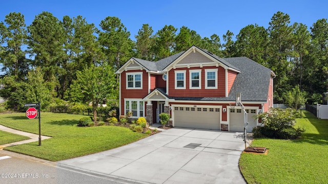 craftsman-style home with a garage and a front yard