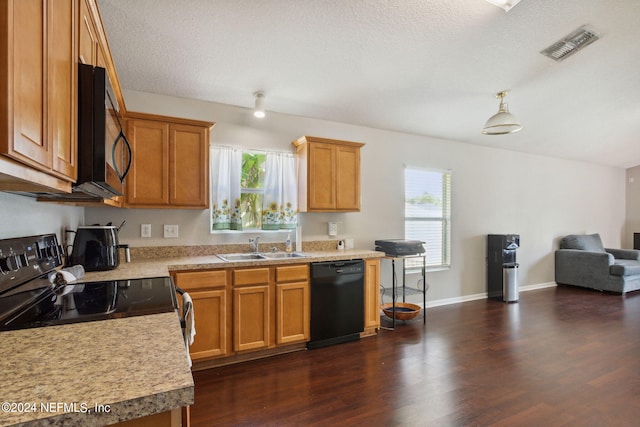 kitchen with sink, dark hardwood / wood-style flooring, black appliances, and a healthy amount of sunlight