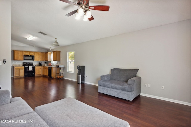 living room featuring dark hardwood / wood-style flooring, lofted ceiling, and ceiling fan