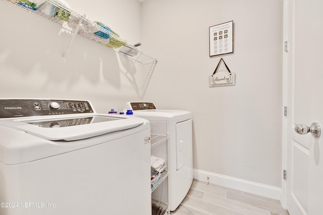 washroom with independent washer and dryer