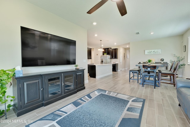 living room featuring ceiling fan