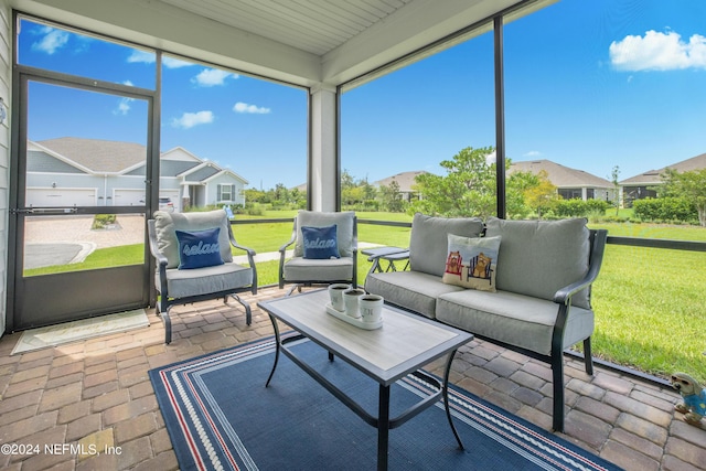 sunroom featuring a healthy amount of sunlight