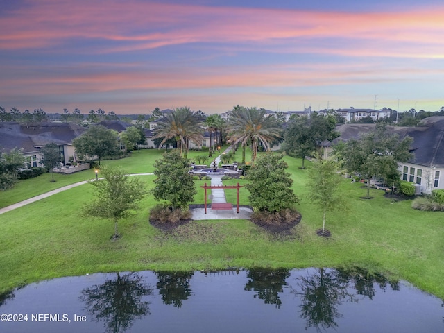 aerial view at dusk with a water view