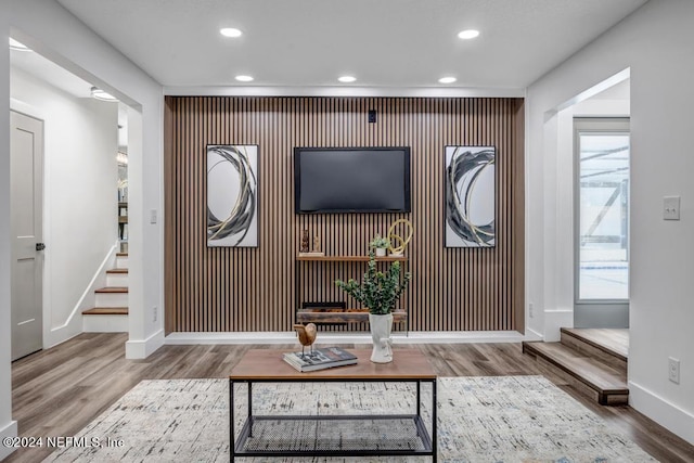 living room with plenty of natural light and hardwood / wood-style floors