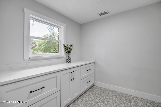 bathroom featuring vanity and tile patterned flooring