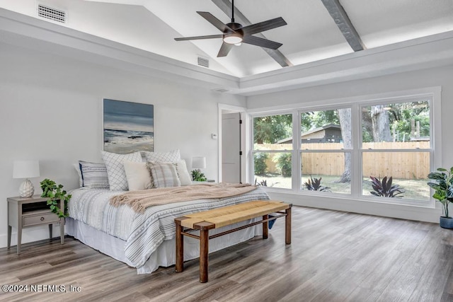 bedroom with high vaulted ceiling, hardwood / wood-style flooring, beam ceiling, and ceiling fan