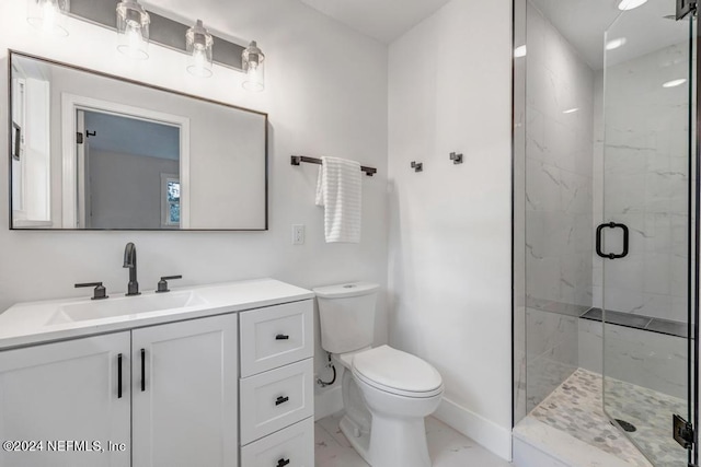 bathroom with tile patterned floors, toilet, a shower with door, and vanity