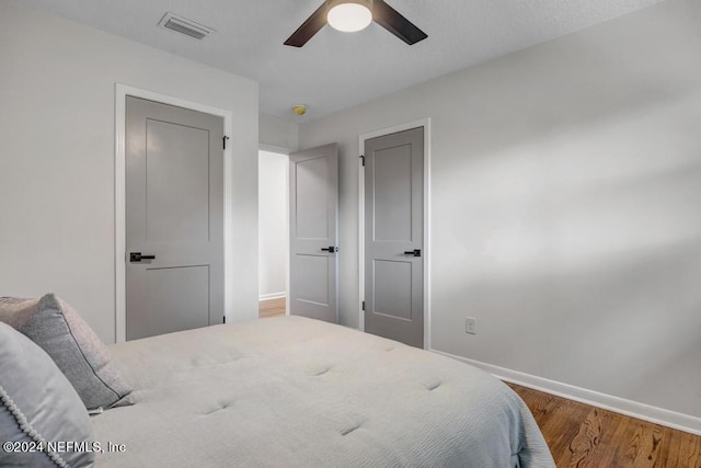 bedroom featuring ceiling fan and hardwood / wood-style flooring