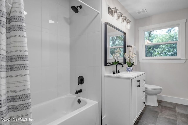 full bathroom featuring tile patterned floors, shower / bath combo, toilet, and vanity