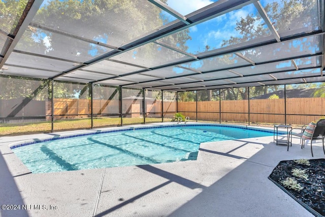 view of pool featuring a lanai and a patio area