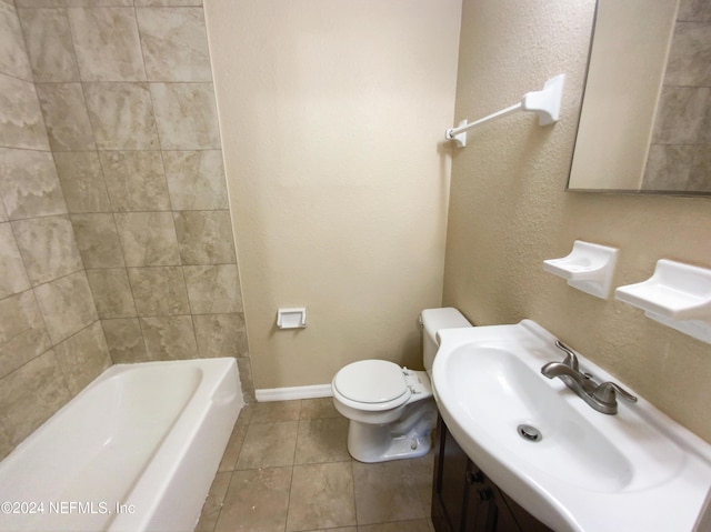 full bathroom featuring bathtub / shower combination, toilet, vanity, and tile patterned flooring