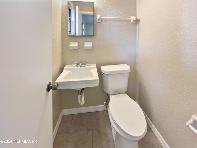 bathroom featuring sink and toilet