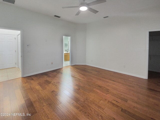 empty room featuring ceiling fan and wood-type flooring