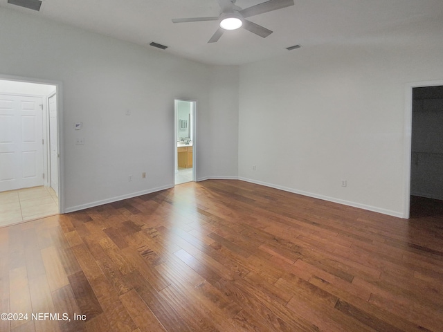 spare room with hardwood / wood-style flooring and ceiling fan