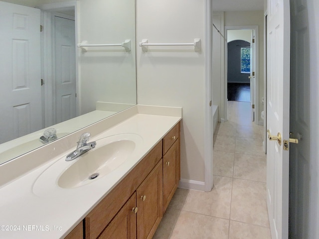 bathroom with tile patterned flooring and vanity