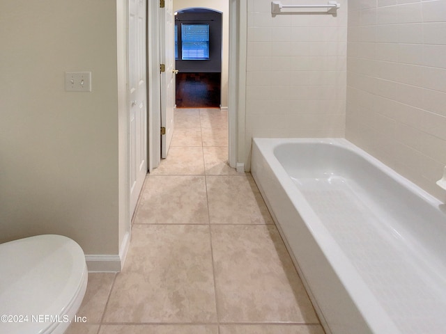 bathroom featuring toilet and tile patterned floors