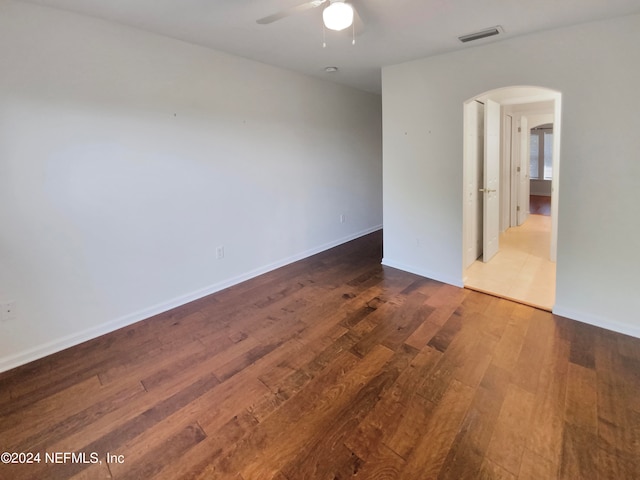 tiled spare room with ceiling fan