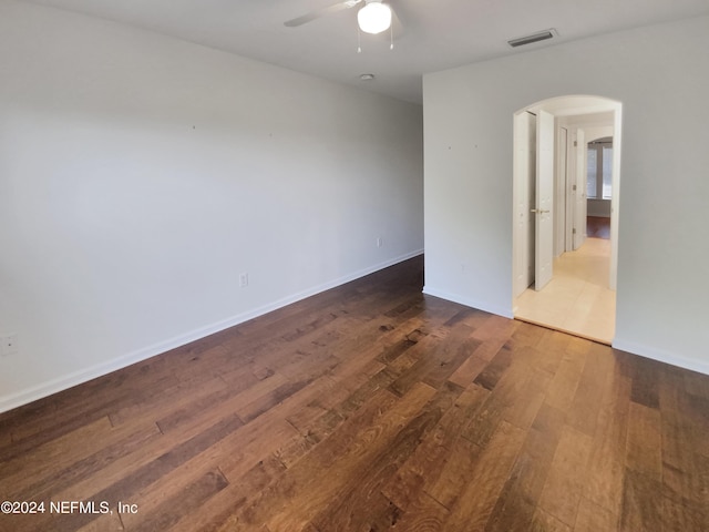 empty room featuring wood-type flooring and ceiling fan