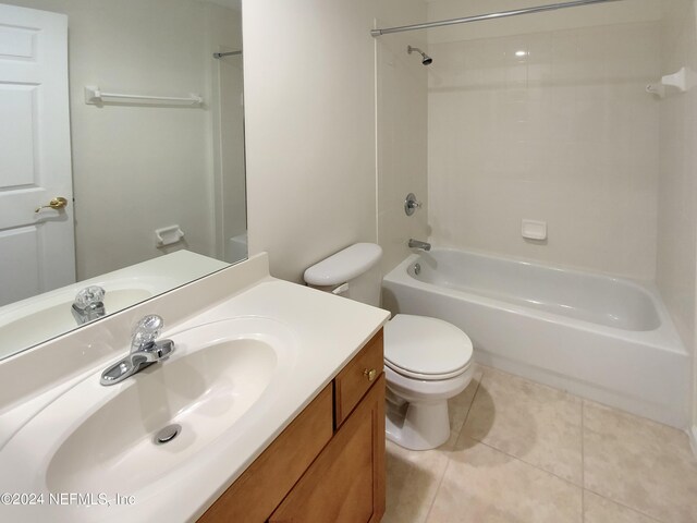 full bathroom featuring vanity, toilet, tile patterned flooring, and bathtub / shower combination