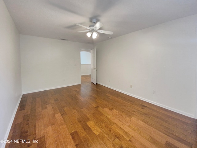 unfurnished room featuring ceiling fan and hardwood / wood-style floors