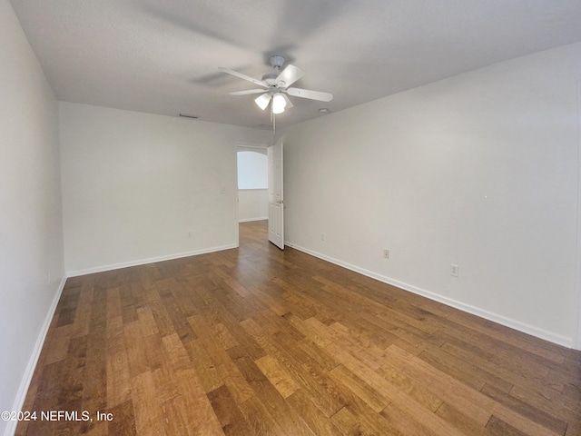 spare room featuring hardwood / wood-style flooring and ceiling fan