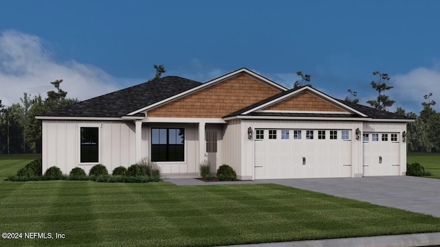 view of front facade with a garage and a front lawn