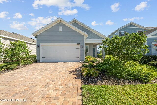 craftsman-style house featuring a garage