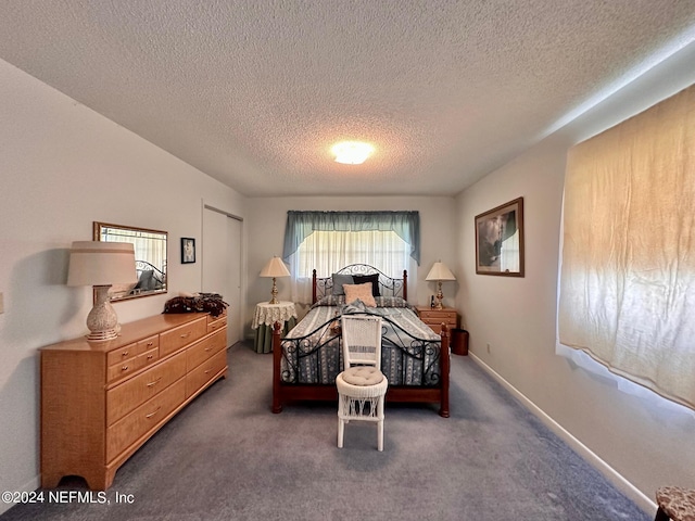 carpeted bedroom with multiple windows and a textured ceiling