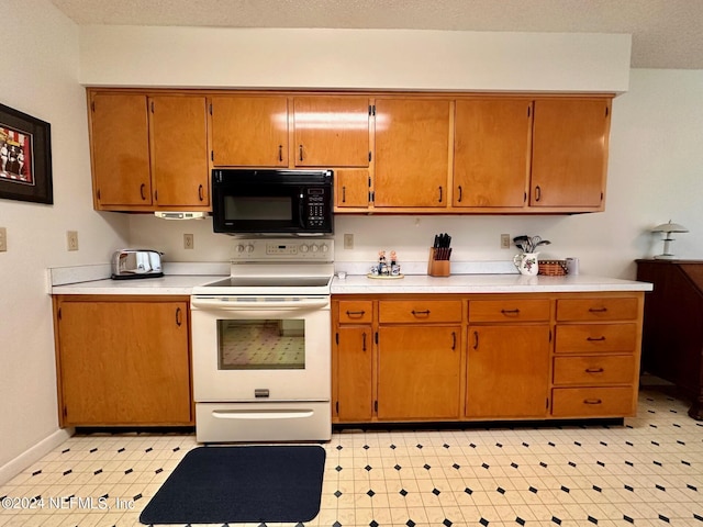 kitchen featuring a textured ceiling and white electric range