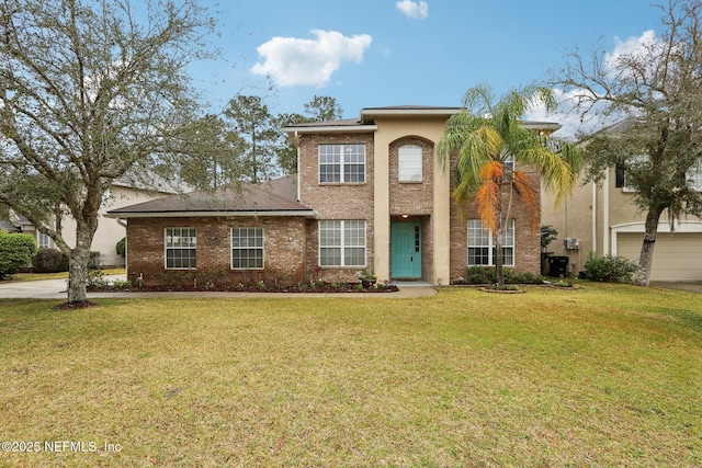 view of front facade featuring a garage, brick siding, and a front yard