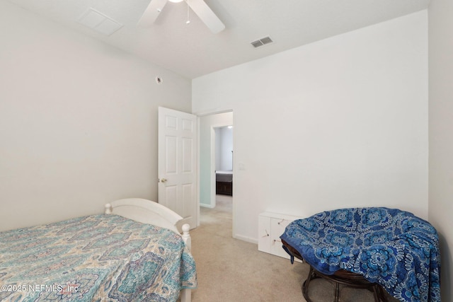 bedroom with ceiling fan, visible vents, and light colored carpet