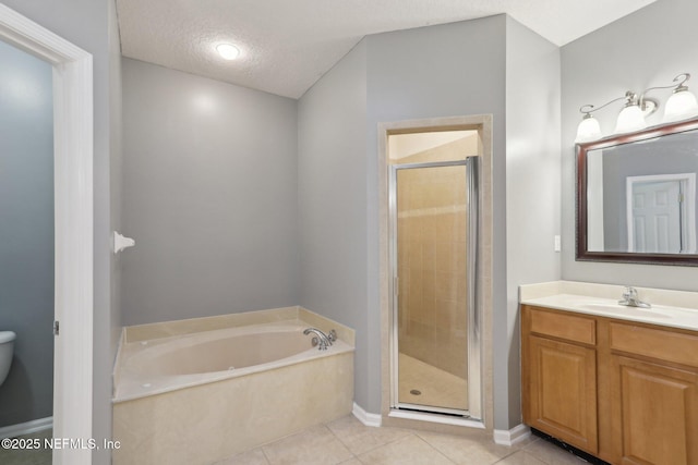 full bath featuring tile patterned flooring, a shower stall, a textured ceiling, and a bath